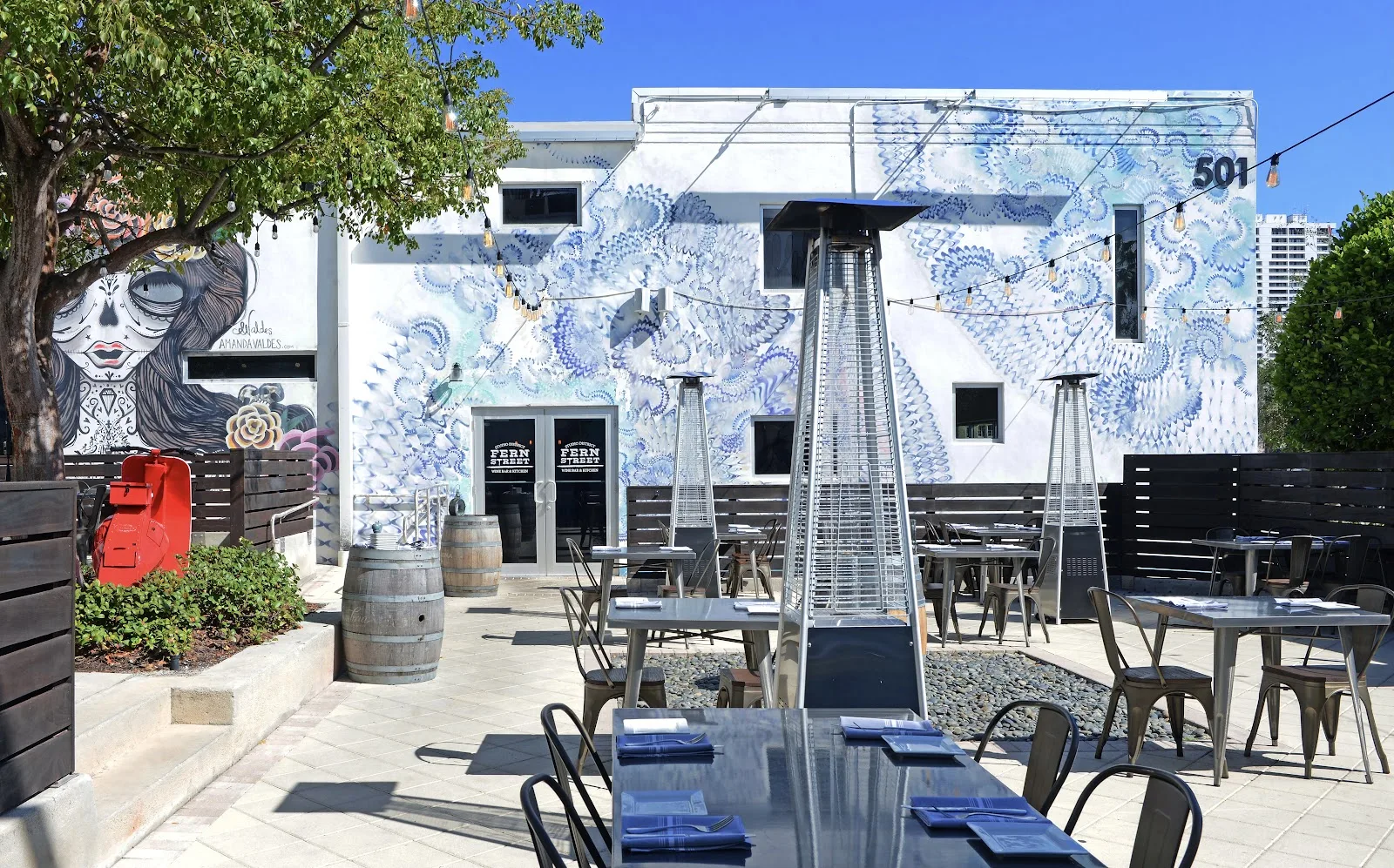 Fern — paisley-mural facade with patio seating