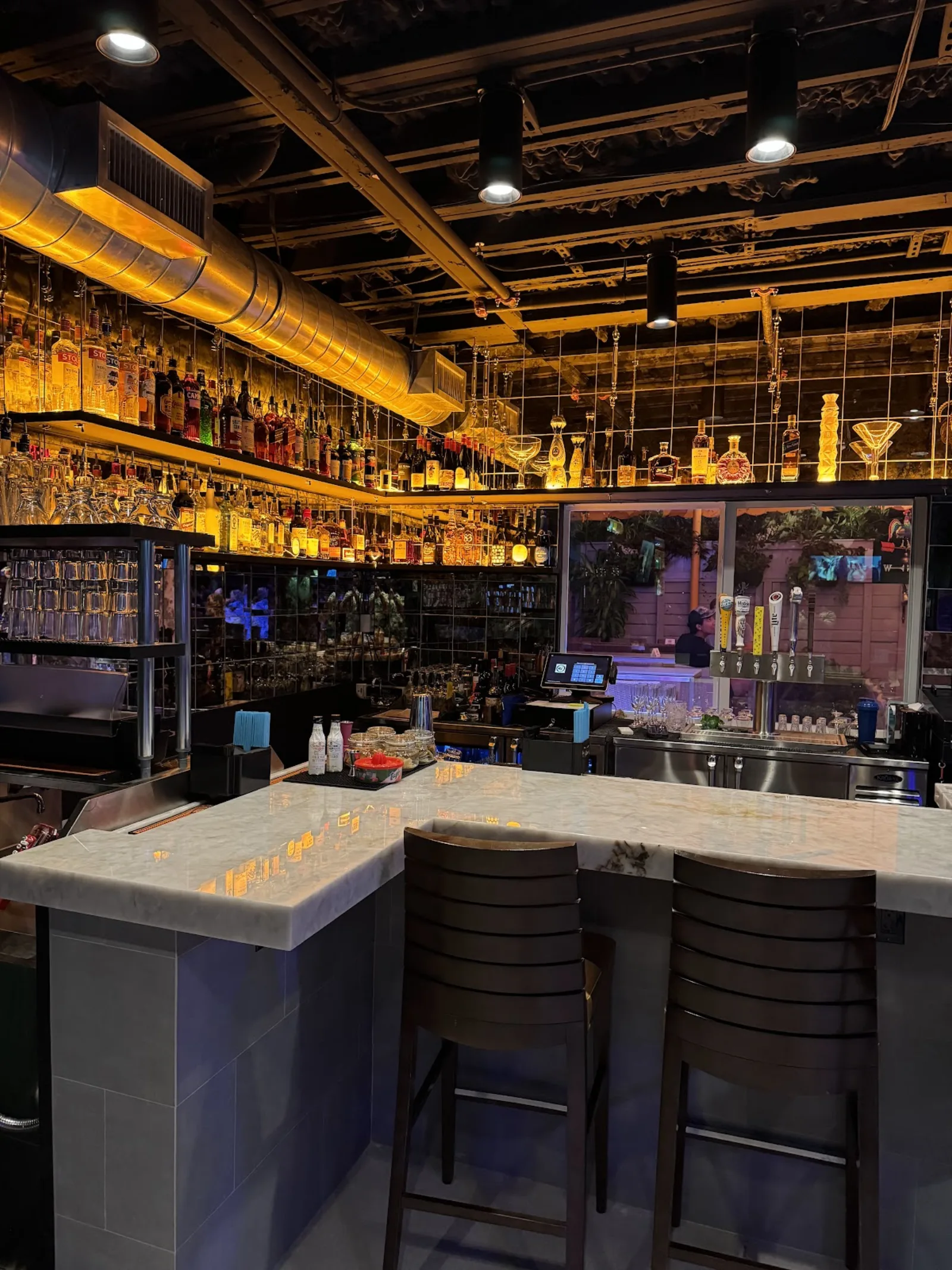 H.G. Rooster's — industrial-chic bar with marble counter