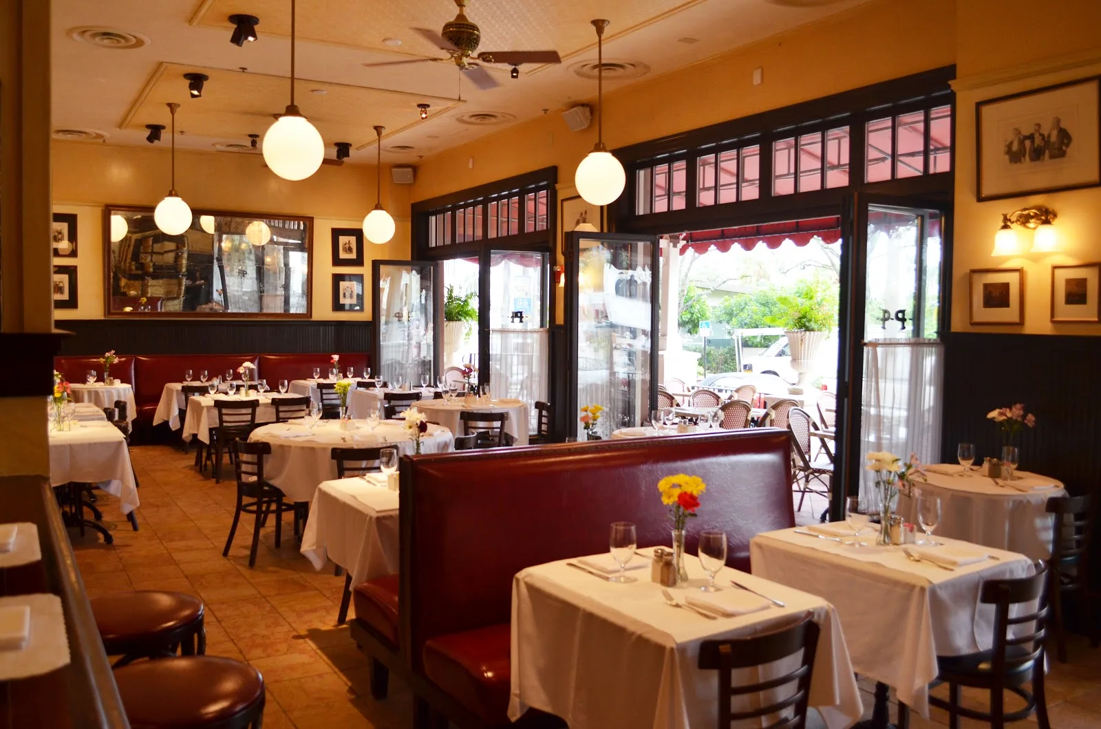 Pistache French Bistro — classic Parisian dining room with globe pendants
